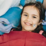 Smiling Child Receiving Gentle Pediatric Dental Care During Routine Checkup