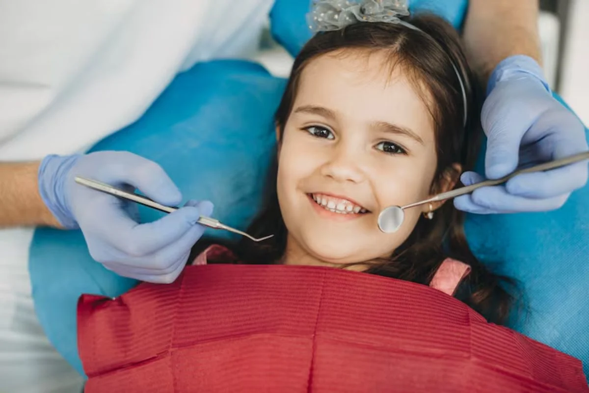 Smiling Child Receiving Gentle Pediatric Dental Care During Routine Checkup