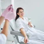 Woman Receiving IV Sedation Treatment In A Comfortable Dental Care Setting