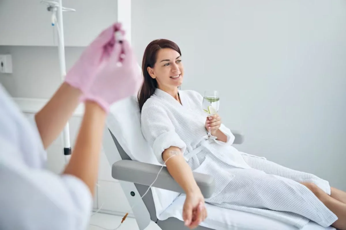 Woman Receiving IV Sedation Treatment In A Comfortable Dental Care Setting