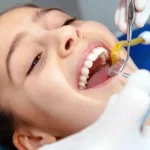 Woman Receiving Professional Dental Cleaning During Routine Dental Checkup