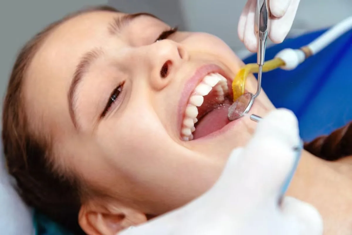 Woman Receiving Professional Dental Cleaning During Routine Dental Checkup
